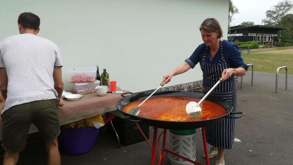 Woman and Paella pan